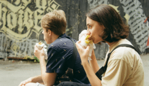 A high-protein balanced meal with lean protein, eggs, legumes, and whole foods arranged on a plate, illustrating how adequate protein intake supports satiety, appetite control, and weight management.